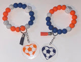 Variety Of Sports Themed Beaded Wristlets With 2" (D) Wooden Or Acrylic Charms